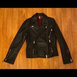 Black leather biker jacket with red lining